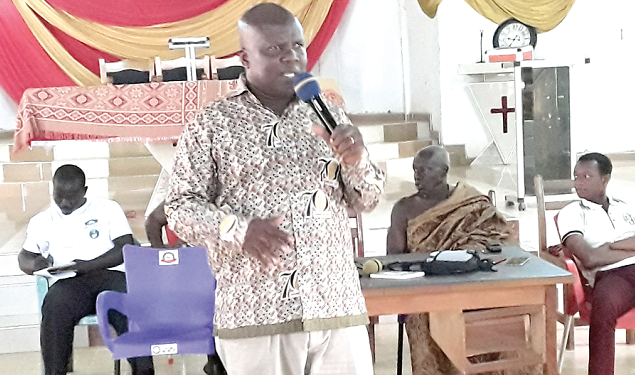 Dr Tackie-Otoo addressing the cocoa farmers who attended the programme 