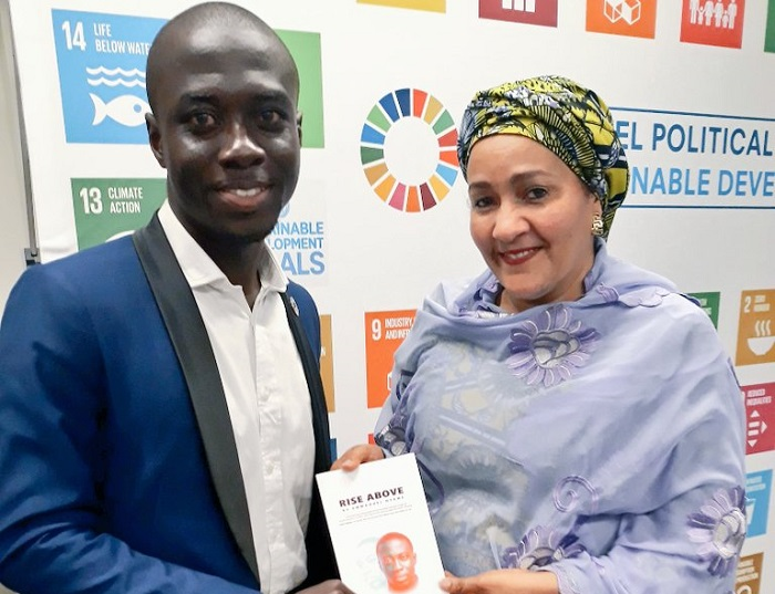 Mr Emmanuel Nyame presents a copy of the book to the UN Deputy Secretary-General Ms. Amina Mohammed