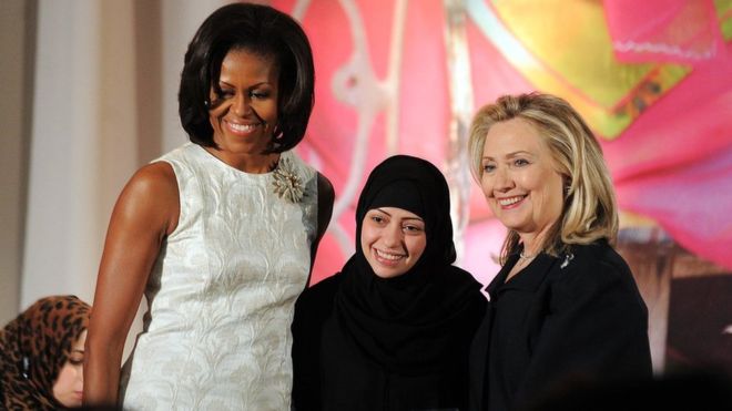Ms Badawi, pictured here with Michelle Obama and Hillary Clinton, received an International Women of Courage Award in 2012