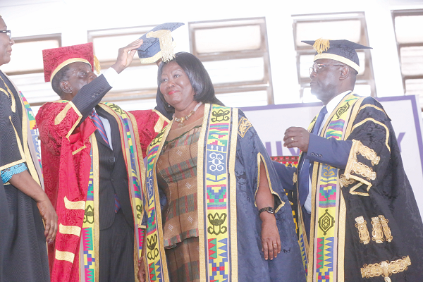 Prof. Ebenezer Oduro Owusu (right), Vice-Chancellor, UG, together with  Prof. Yaw Twumasi (left), Chairman of the University Council, decorating Mrs Mary Chinery-Hesse (middle), Chancellor of the University of Ghana, in Accra. Picture: SAMUEL TEI ADANO 