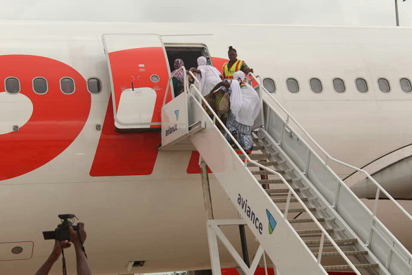 Some of the pilgrims boarding an aircraft