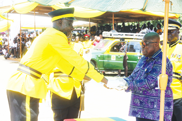 President Akufo-Addo presenting a sword of honour to Senior Under Officer (SUO) Stephen Kumah (left), Best All-Round, at the ceremony. Picture by SAMUEL TEI ADANO