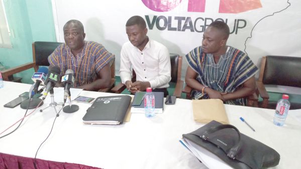 Togbe Hortormaho Amedzake III (left), addressing the media.  Those with him are Koku Amenyaglo (middle), Director in charge of Administration of OVG and Destiny Awlimey (right), Director in charge of Finance of the group