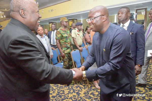 Vice-President Dr Mahamudu Bawumia (right)  exchanging pleasantries with Mr Martin Amidu, the Special Prosecutor, at the anti corruption conference in Accra