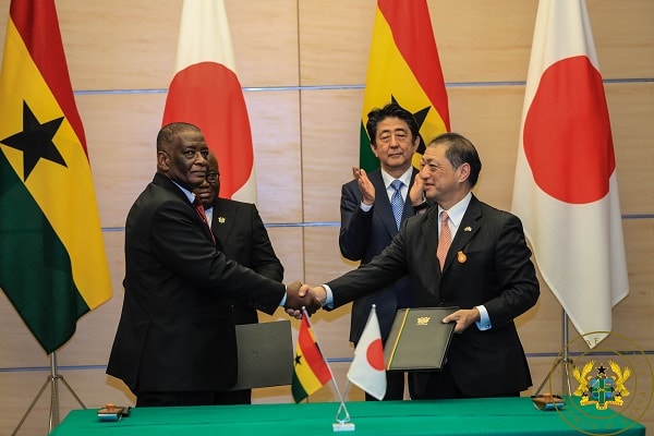 Ghana's Ambassador to Japan, Mr. Frank Okyere, and Japan's Ambassador to Ghana, Mr. Himeno, exchanging the notes after the signing the agreement for the receipt of $57 million