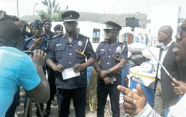 DCOP Francis Ebenezer Doku (with paper in hand) briefing the media