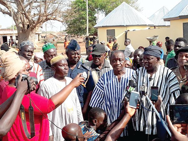  Mr Salifu Saeed (right), the Northern Regional Minister, with his Deputy, Mr Solomon Boar (both in smock), with members of the REGSEC, interacting with the media after the inspection of the temporary structure constructed at the old Gbewaa Palace in Yendi. Picture: Samuel Duodu