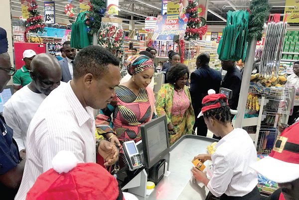Mrs Samira Bawumia paying for an item at the counter at the new mall