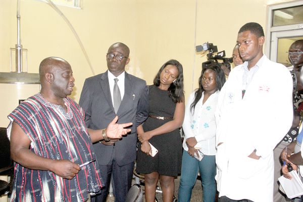 Prof. J. B. Nyarko (left), Director-General of the Ghana Atomic Energy Commission (GAEC), briefing Mr William Aidoo (2nd left), a Deputy Minister of Energy and his entourage during a visit to the Ghana Atomic Energy Commission (GAEC). Picture: Maxwell Ocloo
