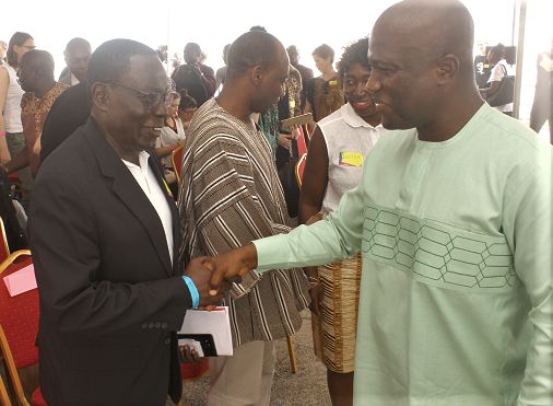 Mr Oliver Boakye (left), Special Advisor to the Minister of Environment, Science and Technology and Innovation, exchanging pleasantries with Mr Mohammed Nii Adjei Sowah (right), the Accra Metropolitan Chief Executive, after the conference 