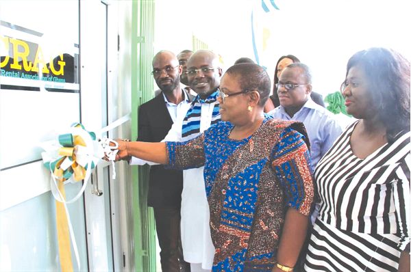 Mrs Bella Ayayee Ahu, President of HOTCATT cuting the ribbon to officially open the new office of CRAG. With her are Mrs Benedicta Baabu Anokye (right), Mr Akweasi Agyeman (2nd left) and Mr Seth Ocran (left)