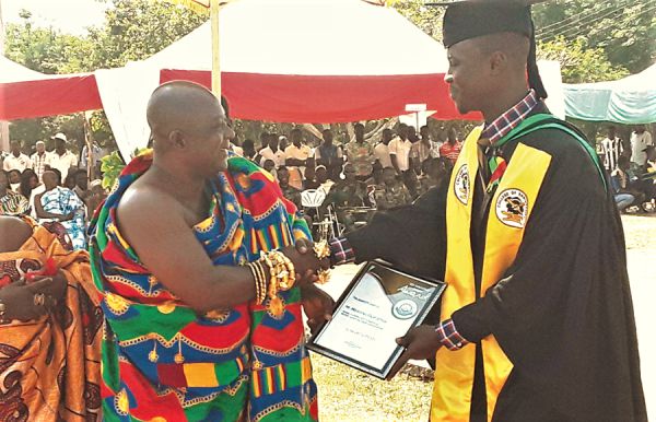 Mr Elija Mawunyo receiving the Overall Best Student award from the Krontihene of the Sunyani Traditional Area, Nana Bofotia Boamponsem II.