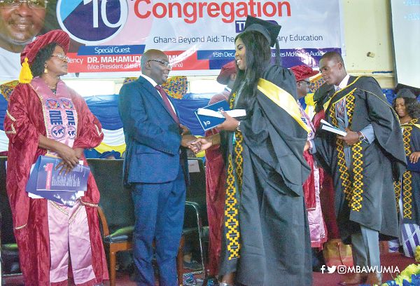Vice-President Dr Mahamudu Bawumia congratulating some of the graduates at the 10th congregation of the Pentecost University College (PUC) in Accra
