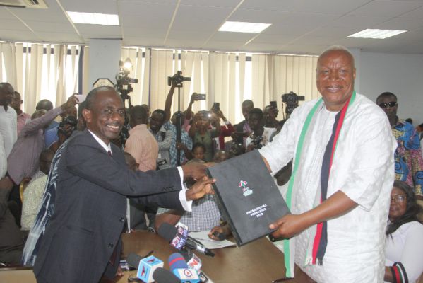  Mr Asiedu Nketia receiving the nomination forms from Prof Joshua Alabi (right)