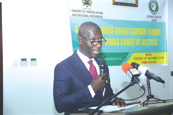 Justice Edward Asante (left), President of the ECOWAS Court of Justice speaking at the event. Some participants at the event (right)