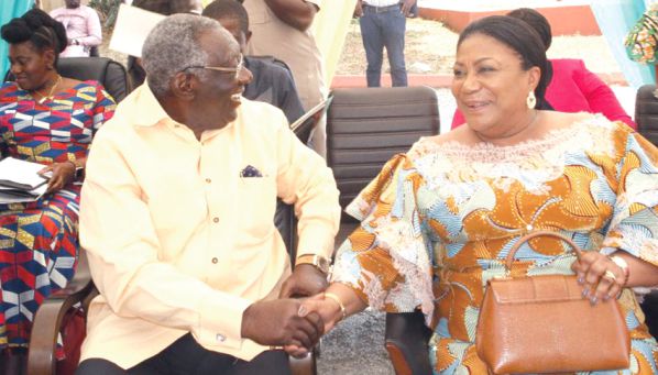 Mrs Rebecca Akufo-Addo and former President John Agyekum Kufuor, exchanging pleasantries