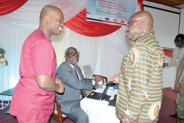 Col Mathew Dakwah (retd) [right] in a chat with Mr Alexander Acquaye (left). With them is Capt Awuni (retd)