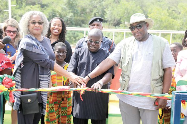 The pontoon for the Volta Regional Health Directorate. (Inset)  Mr Kingsley Aboagye-Gyedu (2nd right), being assisted by Ms Sharon Cromer (left), and Dr Koku Awoonor (right), Director, PPME, to cut the ribbon to officially inaugurate the pontoon. Picture: EMMANUEL ASAMOAH ADDAI     