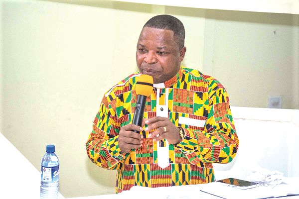 Rev. Charles Adom Darkwa (right) delivering the sermon to the congregation 