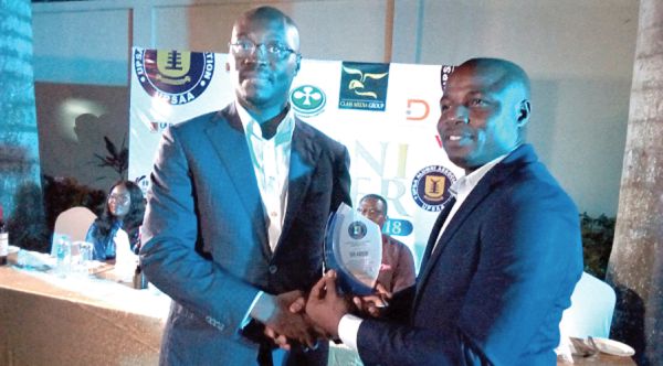 Mr Ato Forson receiving his award from Mr Mawutor