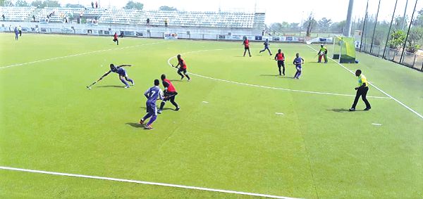 Sylvester Apronti of Exchequers stretches to control the ball as teammate Samuel Mensah (7) closes in to support