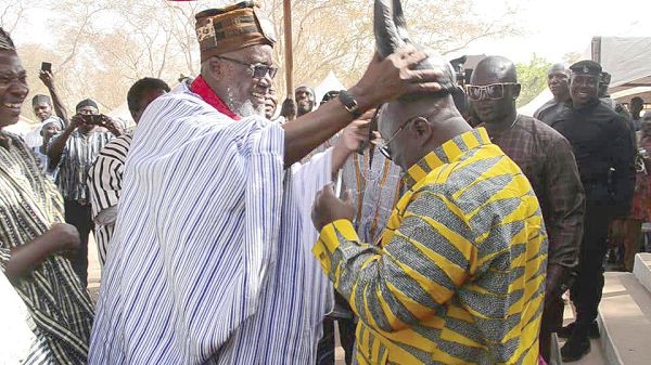 President Nana Addo Dankwa Akufo-Addo being decorated by Nab Azagsuk Azantilow with the ancestral headgear of the people of Builsa as a sign of bravery, at the Feok Festival