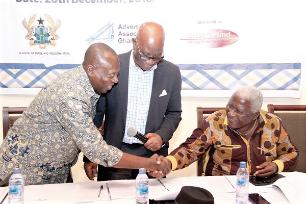 Mr Ebenezer Adjirackor (left), the Chief Director, Ministry of Trade and Industry interacting with Mr Torgbor Mensah, President, Advertising Association of Ghana (AAG) while Professor Timothy Acquah-Hayford, Chairman, Ethics and Standard Committee, AAG looks on. Picture: BENEDICT OBUOBI