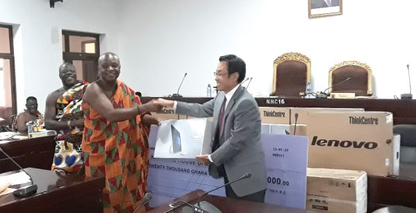 Mr Shi Ting Wang (right) handing over the items to Togbe Afede XIV