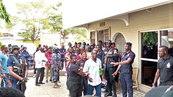 One of the observers being escorted out of the resticted area by the police. Picture: Benedict Obuobi