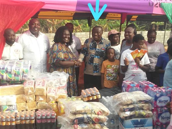 Rev. Ohenese Gyan-Agyei (arrowed) in a handshake with Ms Jane Irina Adu, founder of the orphanage 