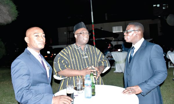Mr Joe Ghartey (middle) interacting with Mr Justice Ofori (right) Commissioner of Insurance and Mr Agyenim-Boateng  Deputy Minister of Railways 
