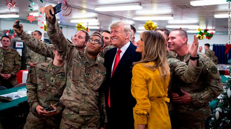 President Donald Trump and his wife, Melania greet military peronnel at Al Asad Air Base during his surprise visit to Iraq