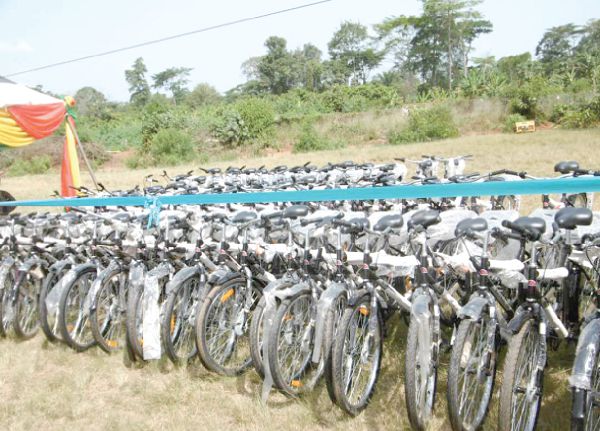  The bikes for distribution. Mr Eric Showell (inset) speaking at the function  