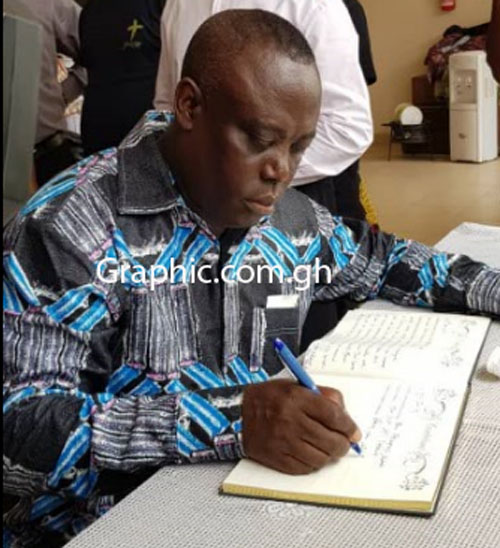 Rev Prof Paul Frimpong Manso, General Superintendent of Assemblies of God signing the book of condolence