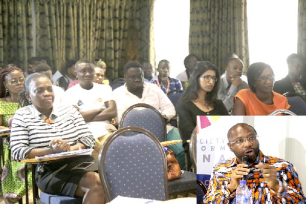 INSET: Dr Gilbert Buckle speaking at the function. A section of the participants who attended the national health dialogue