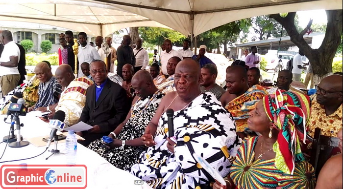 Nii Adjei Kraku II, Paramount Chief of Tema Traditional Area, (in black and white cloth and with mic), addressing the function