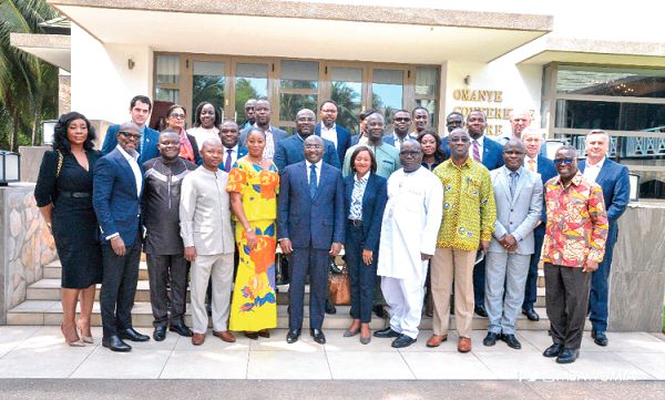  Vice-President Dr Mahamudu Bawumia (middle) with the  participants after the breakfast meeting