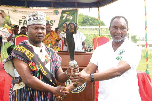 Mr Daniel Alexander Nii Noi Adumuah (right), Adentan Municipal Chief Executive, presenting the “Sword of Honour” to Mr Mohammed Ahmed Charley, the 2018 Overall Best Municipal Farmer. Picture: Maxwell Ocloo