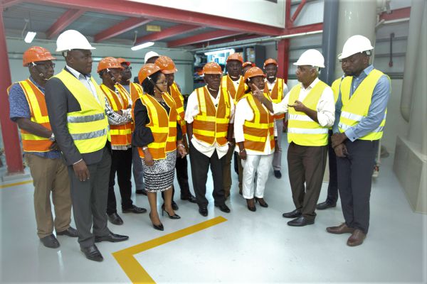 Mr Anil Kansara (right) briefing the Board Members during the tour of the refinery. Also in the picture in Mr Sampson Nortey (left), MD of Gold Coast Refinery