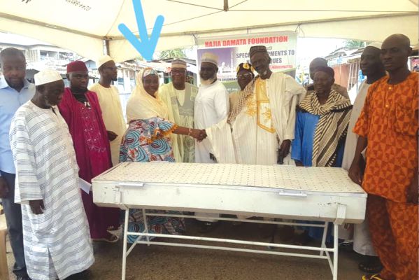  Hajia Damata Suleman (arrowed), founder of the Damata Foundation presenting the equipment to the imans from the nine beneficiary mosques