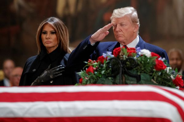 Trump pays respects as Bush lies in state