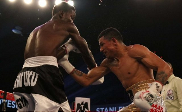 Maxwell Awuku is pinned to the ropes as Miguel Berchelt goes on the attack last Saturday