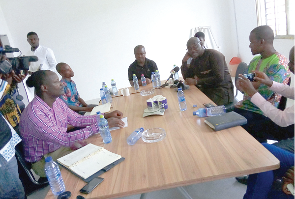 EPA officials in a meeting with the factory authorities