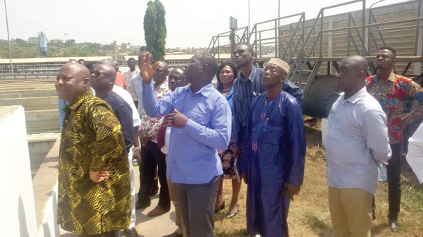 Mr Augustine Atigbire (2nd left), Station Manager, Weija Treatment Plant, explaining issues to the members of the Works and Housing Committee of  Parliament