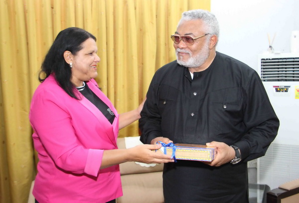 Madam Mercedes Lopez Acea, Vice-President of the Cuban Council of State presenting a gift to former President Rawlings 