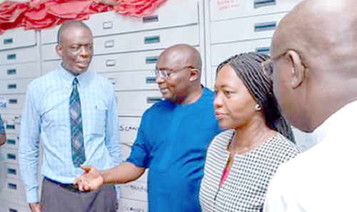 Vice-President Mahamudu Bawumia (3rd right) making enquiries at one of the offices of the Lands Commission during his visit