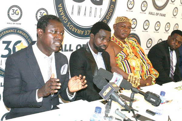Dr George Adayi-Nwoza Adiah (left), Lecturer, Business school, GIMPA speaking at the press conference, with him are Mr Prince Mackay (2nd left) CEO of Good Governance Hall of Fame and awards, Odeefoo Oteng Korankye II (2nd right), Berekwo Hene and also Akwapem kwafo hene. Picture: INNOCENT K. OWUSU.