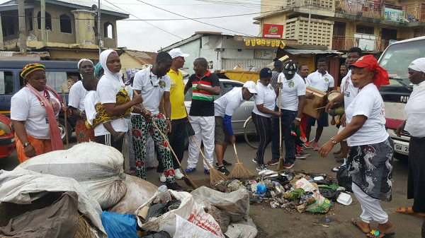 Some of the group members gathering some rubbish at Nima