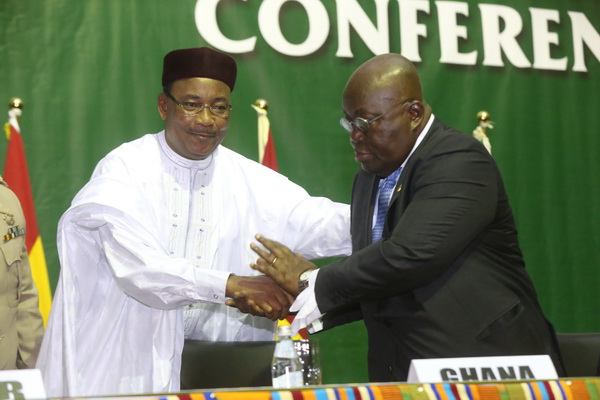 President Akufo-Addo in a hand shake with Mr Mohamadou Issoufou, President of Niger, at the ceremony.