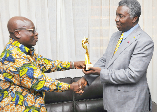 Nana Dei Broni (left), presenting the award to  Prof. Frimpong-Boateng at his office in Accra 